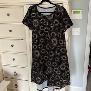 Lularoe Carly dress size M. Black background with gold and cream design.